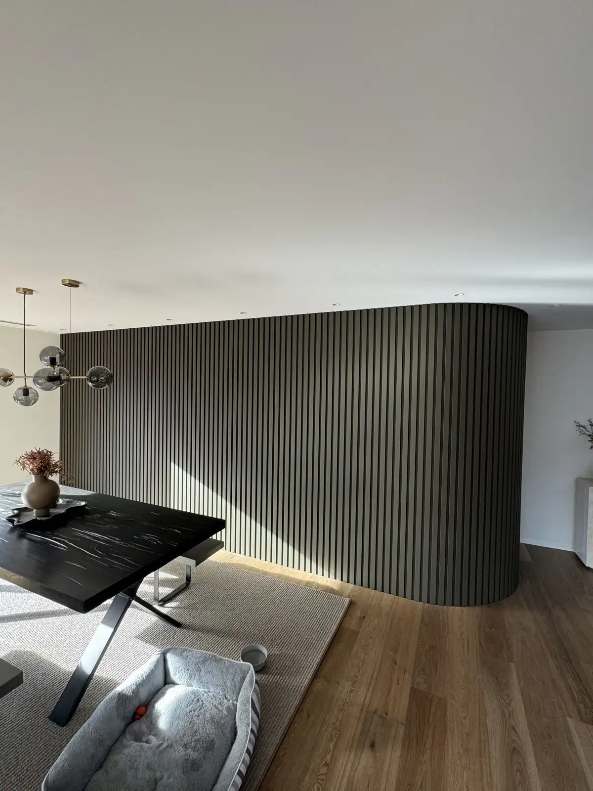 Dark slatted feature wall inside a home on Erin Crescent, Mairehau