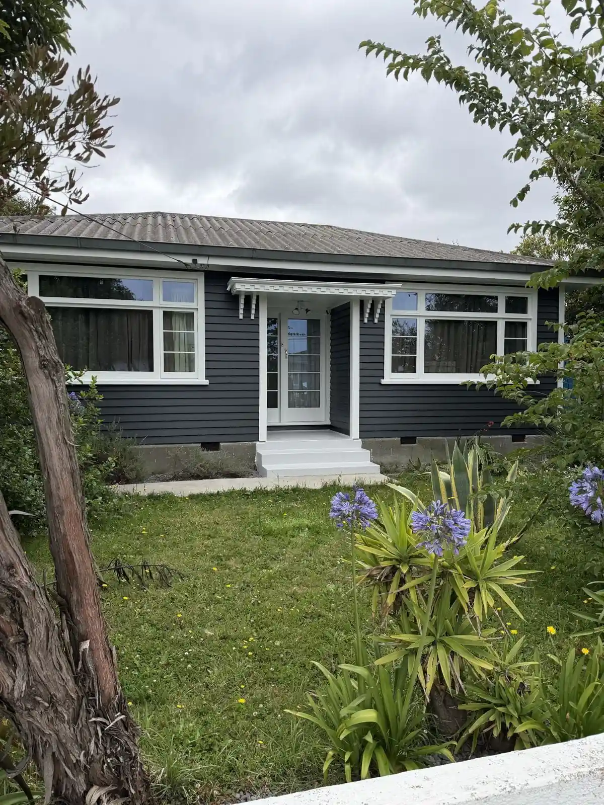 Repainted charcoal bungalow on Nairn Street, Spreydon