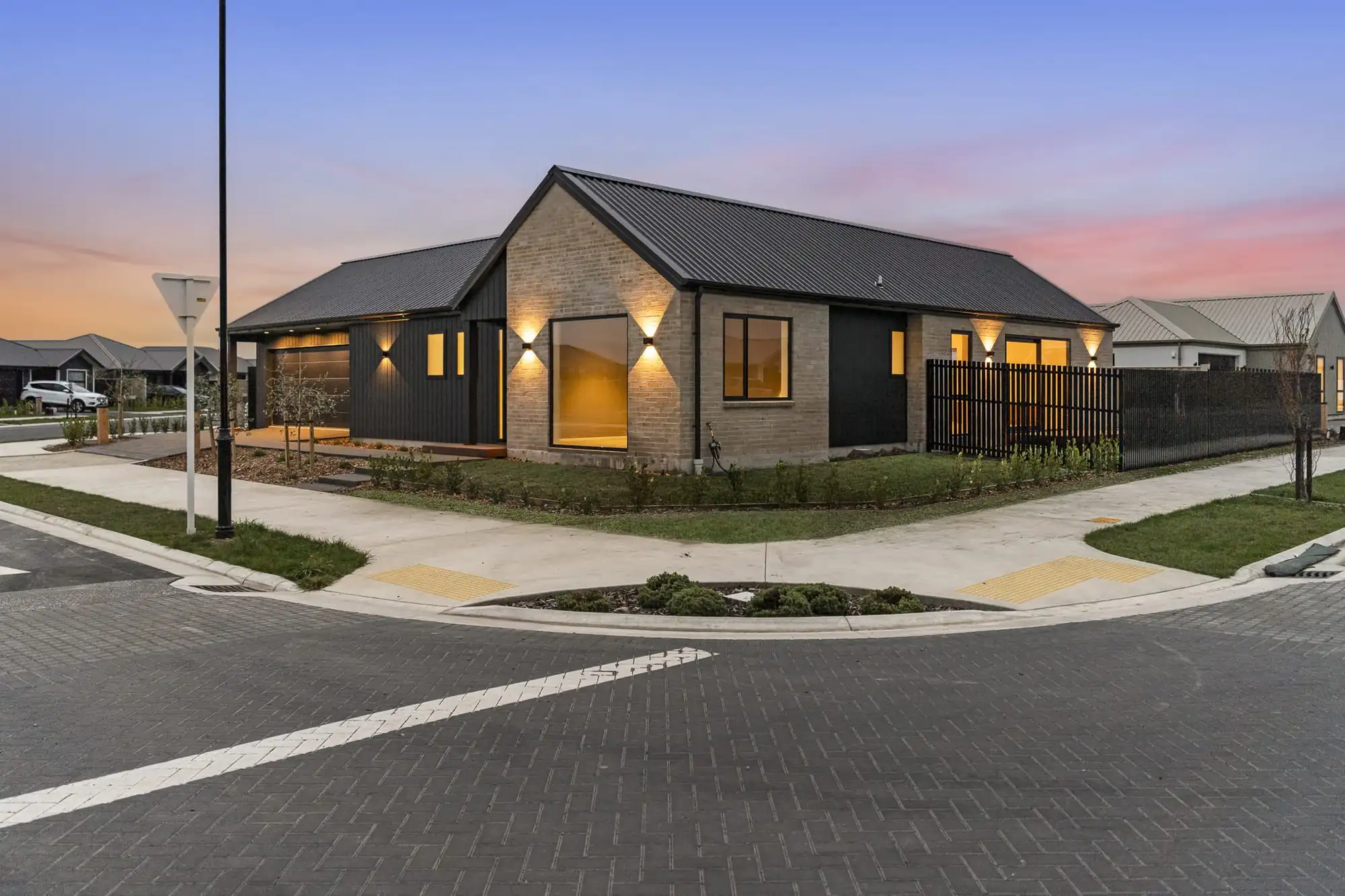 New home on Silvergrass Way, Rolleston, lit up at dusk
